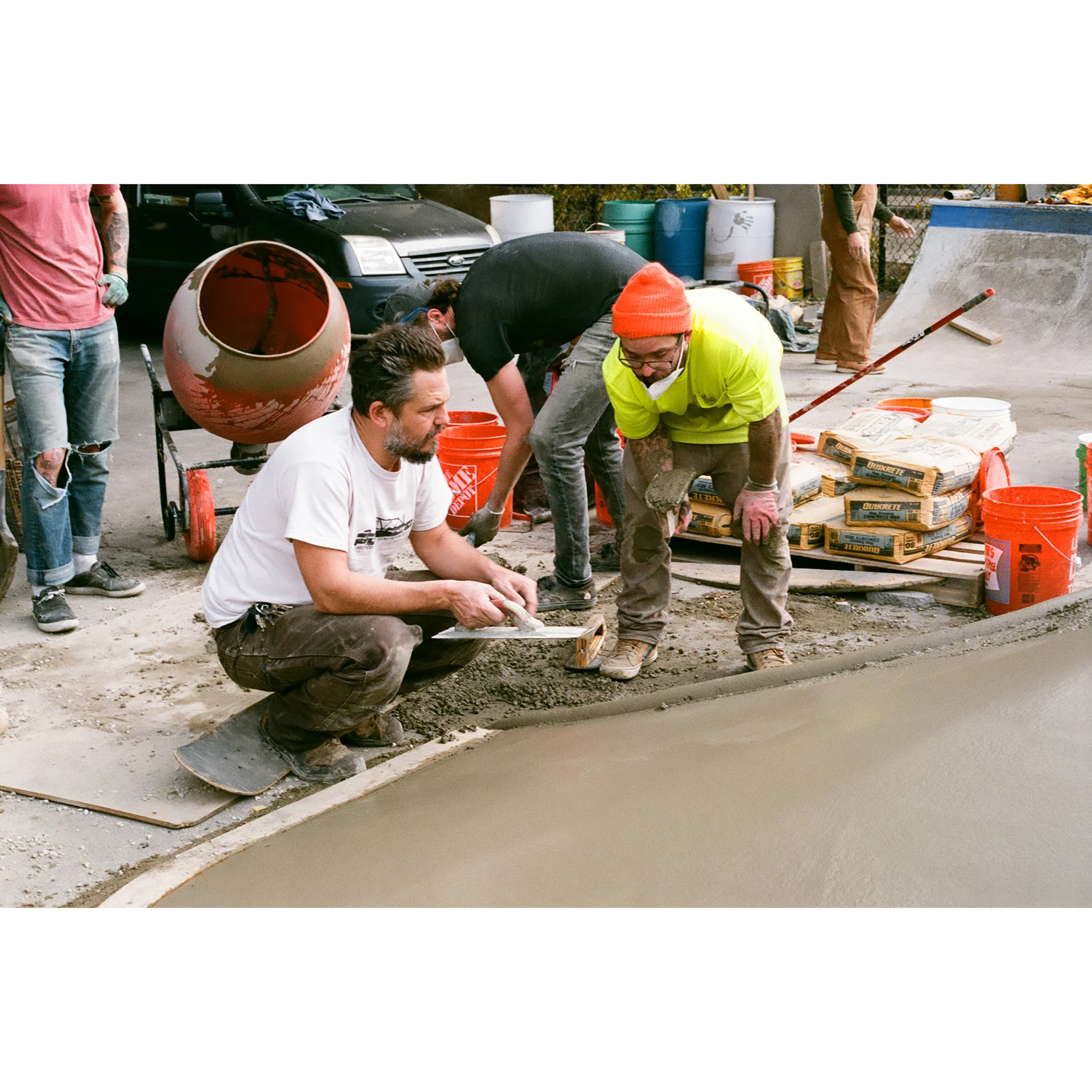 Jon Bartels and Aaron Polasky discuss next moves during a concrete build.